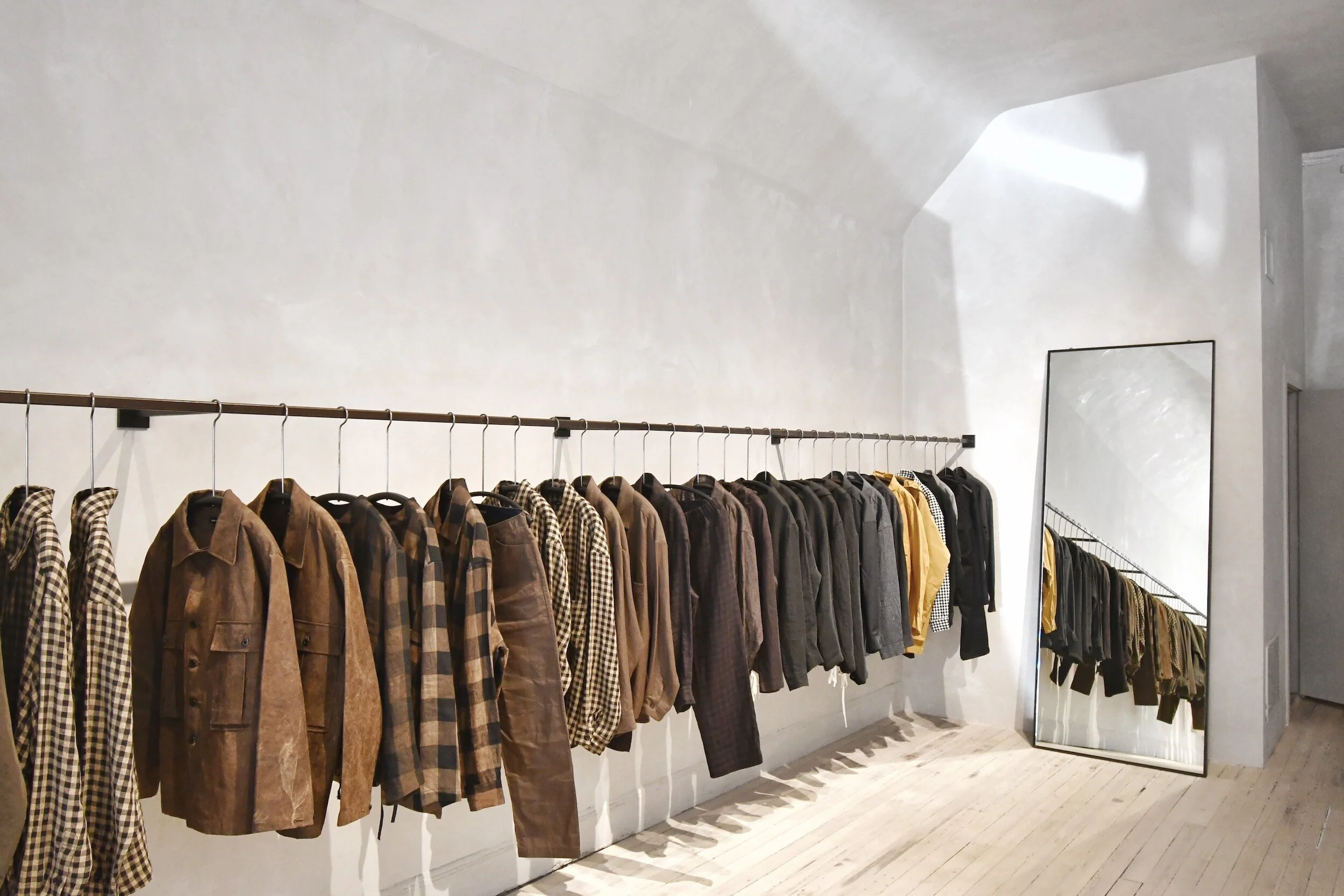 A rack of quality menswear ready to consign